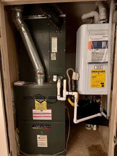 Mechanical closet with a Distinctions furnace and a new tankless water heater