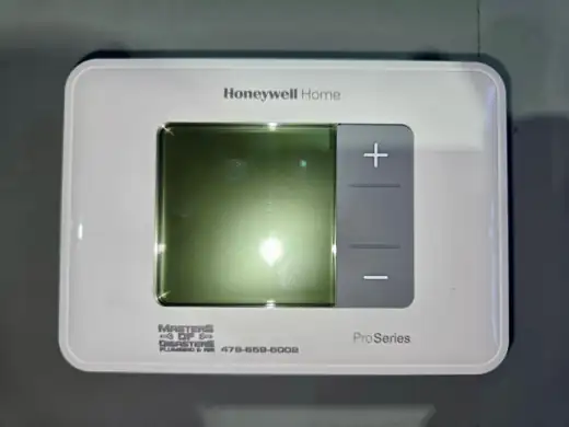 Honeywell Home ProSeries thermostat carrying a Masters of Disasters service sticker